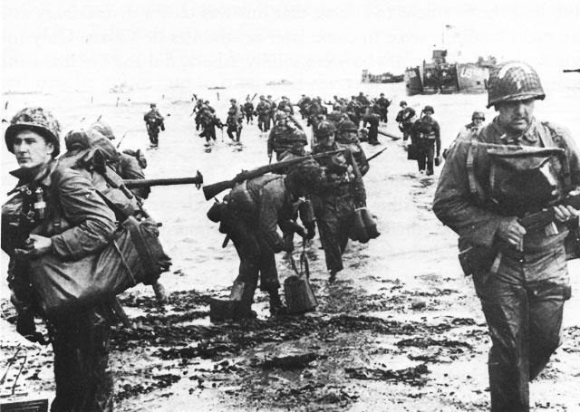 World War 2 D Day image of soldiers landing in the beach