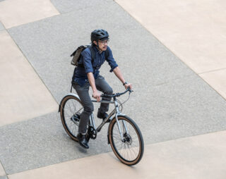 Man riding bike in city from above