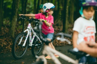 Girl pushing a Marin Donky Jr bike, Japan.