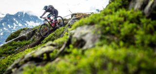 Martha Gill racing an Enduro World Series event, in the mountains of Europe.