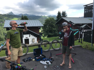 Marin's Chris Holmes and Matt Cipes, pondering bike repairs in a Les Gets, France parking lot.