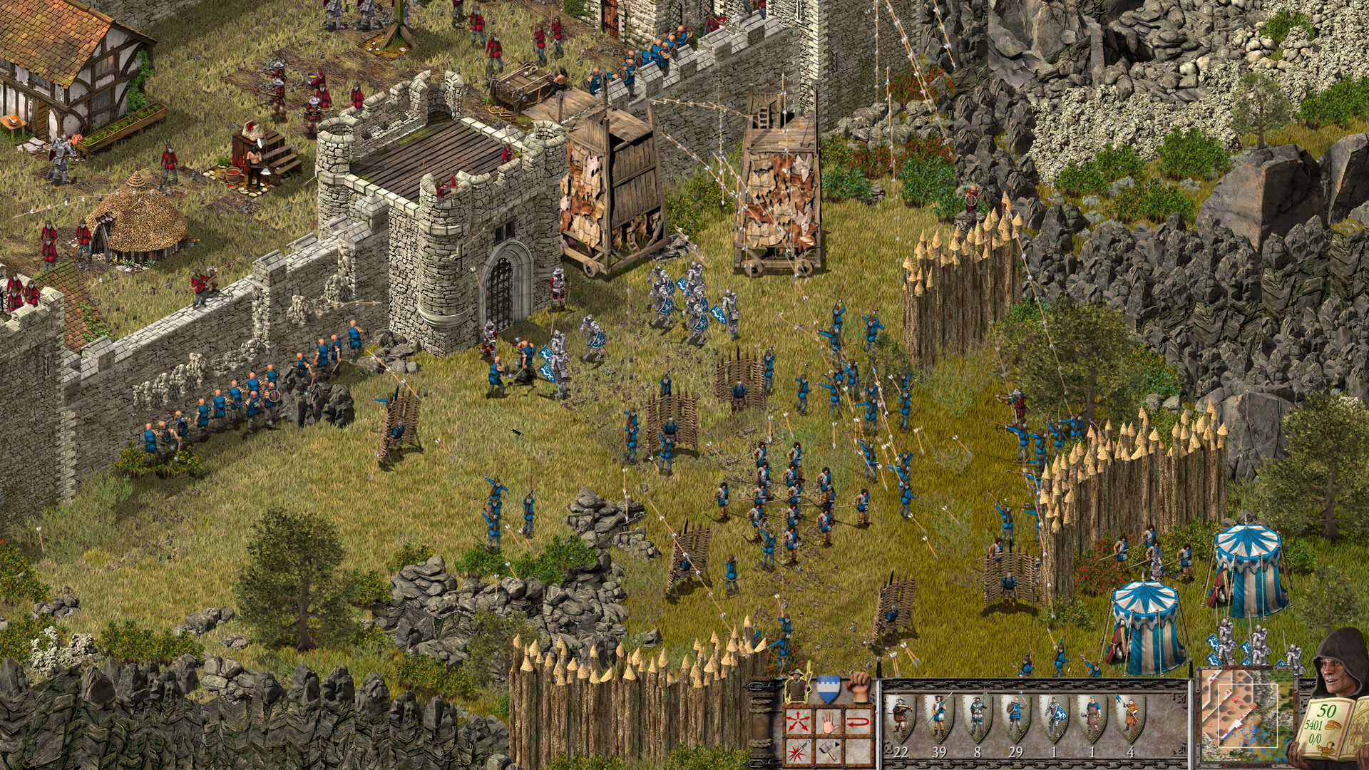 Stronghold Definitive Edition with blue forces attacking a castle